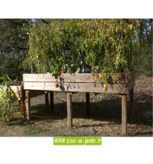 Bac de culture surélevé TPO04 de 100 x 200cm en situation. Ce bac a plantes ou bac jardinière bois est en bois traité classe 4.